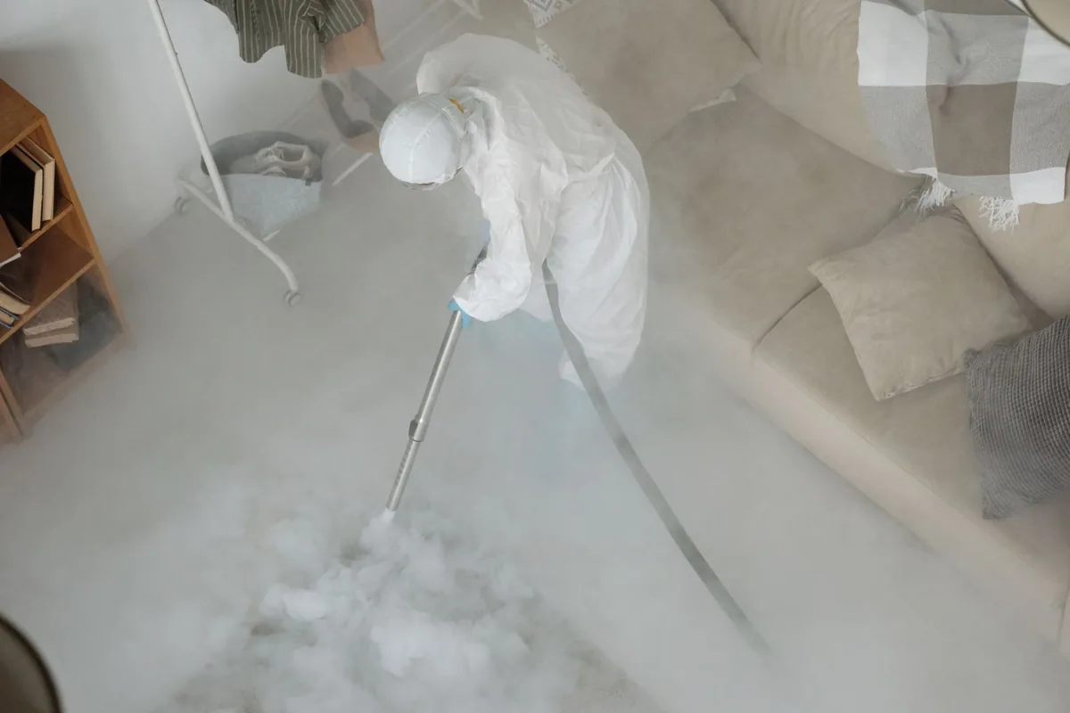 Biohazard cleanup technician in protective equipment, North Bend, OR